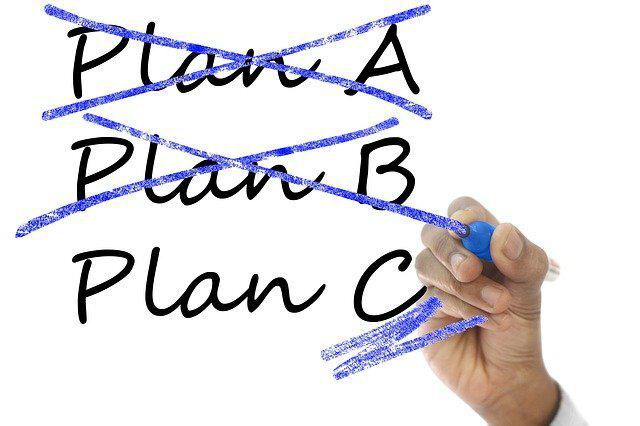 Photo of someone crossing out a handwritten 'Plan A and Plan B'.